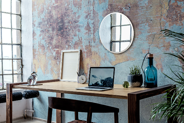 Een ronde spiegel voor in de hal in een witte lijst fi 100 cm