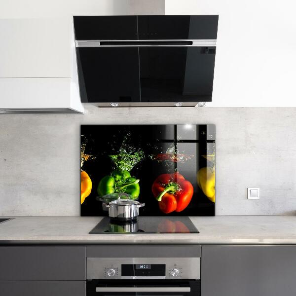 Keuken achterwand glas Kleurrijke paprika's onder water